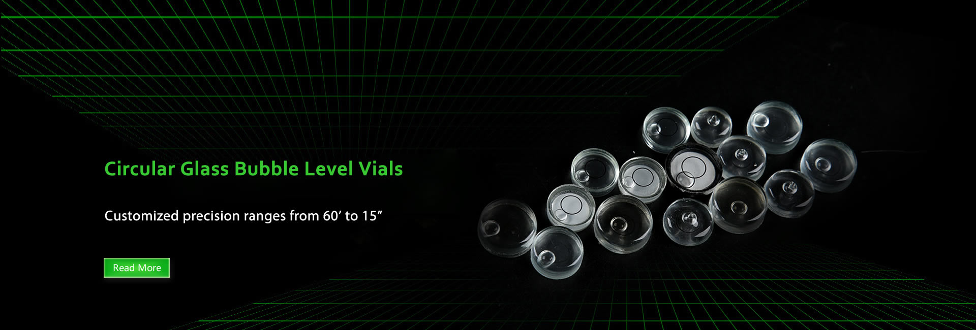 Several glass bubble levels in different colors, bases and shapes on the black background.